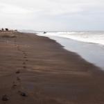 Where is the beach with black volcanic sand in bali